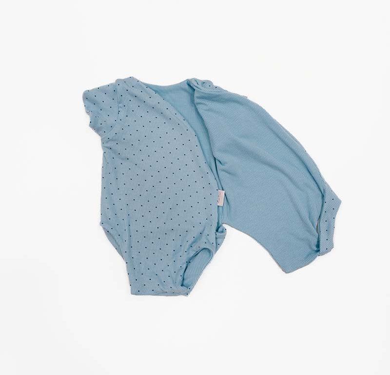 Reversible Dotted Blues design short-sleeved winged bodysuit in silky modal fabric.