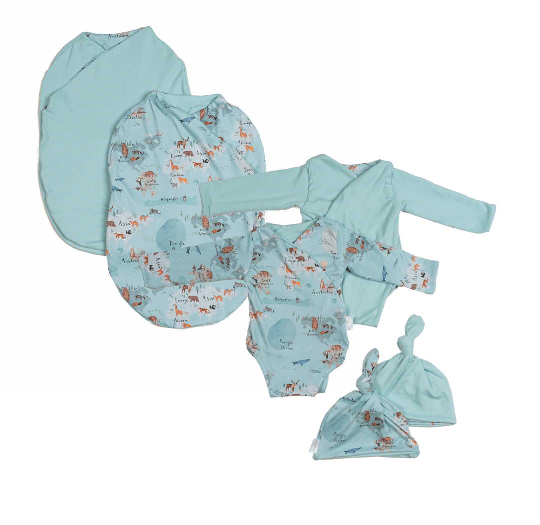 Newborn bundle with long sleeve essentials in classic brushed fabric with world traveler design.
