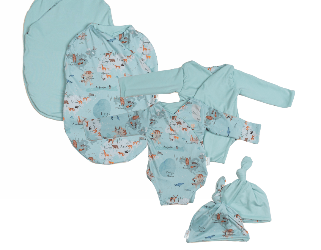 Newborn bundle with long sleeve essentials in classic brushed fabric with world traveler design.