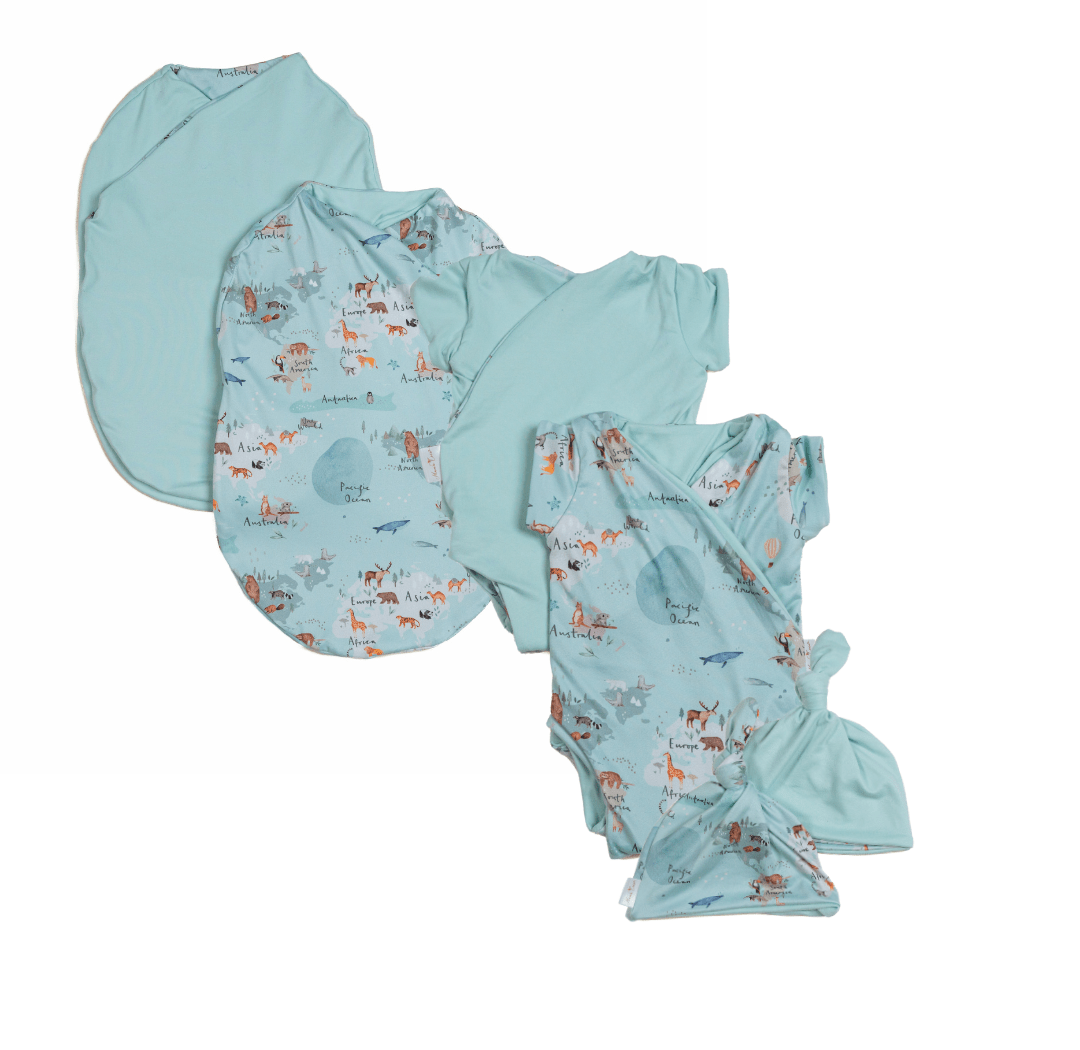 Newborn essentials bundle with short sleeves in classic brushed fabric with world traveler design.