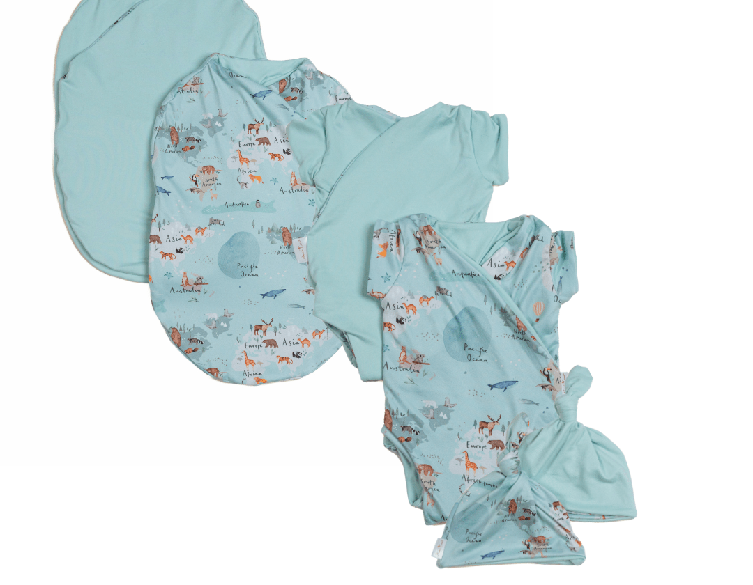 Newborn essentials bundle with short sleeves in classic brushed fabric with world traveler design.