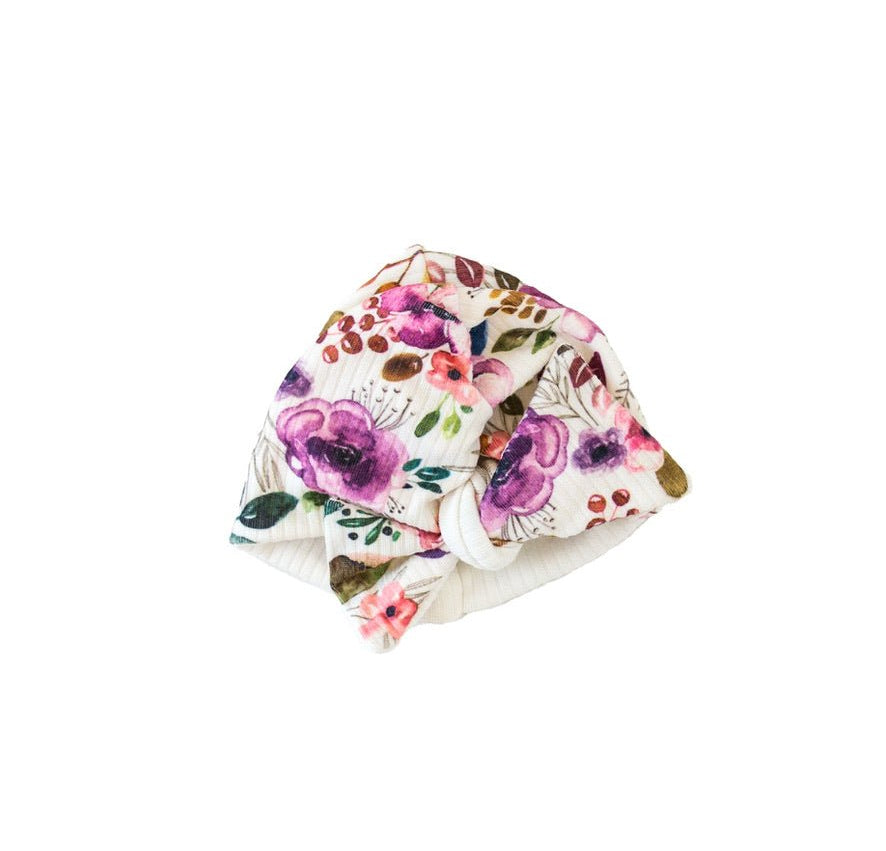 Comfortable Ivory Wildflowers ruched baby beanie with bow crafted from classic brushed baby fabric.