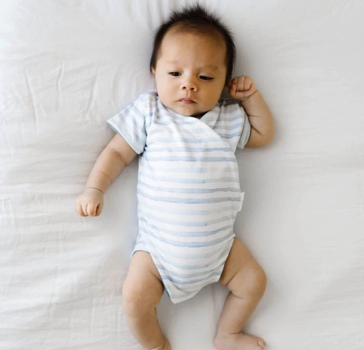 Reversible short-sleeve onesie outfit bundle in chambray waves design.
