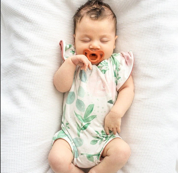 Blushing eucalyptus design flutter sleeve baby onesie and knotty beanie in classic brushed fabric.