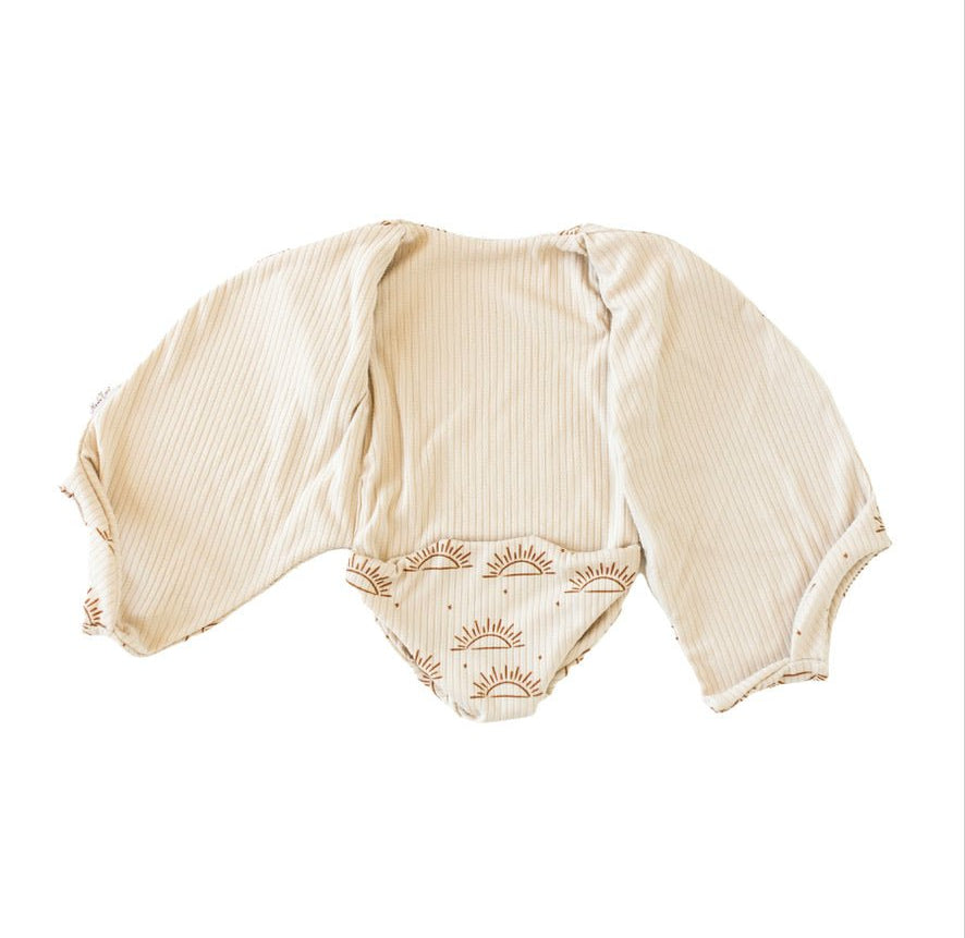 Classic brushed reversible short-sleeve winged bodysuit in Sandy Sunsets for a soft and stretchy outfit.