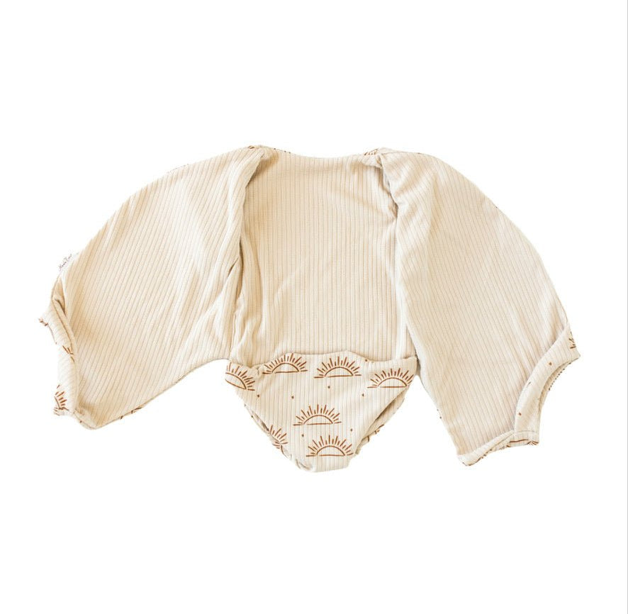 Classic brushed reversible short-sleeve winged bodysuit in Sandy Sunsets for a soft and stretchy outfit.
