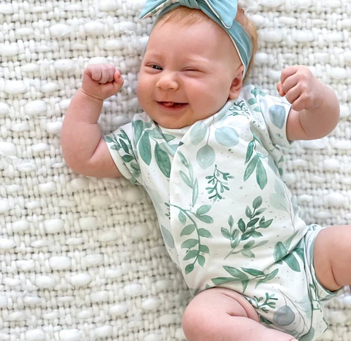 Lightweight short-sleeve winged bodysuit in Saged Eucalyptus design with classic brushed softness.