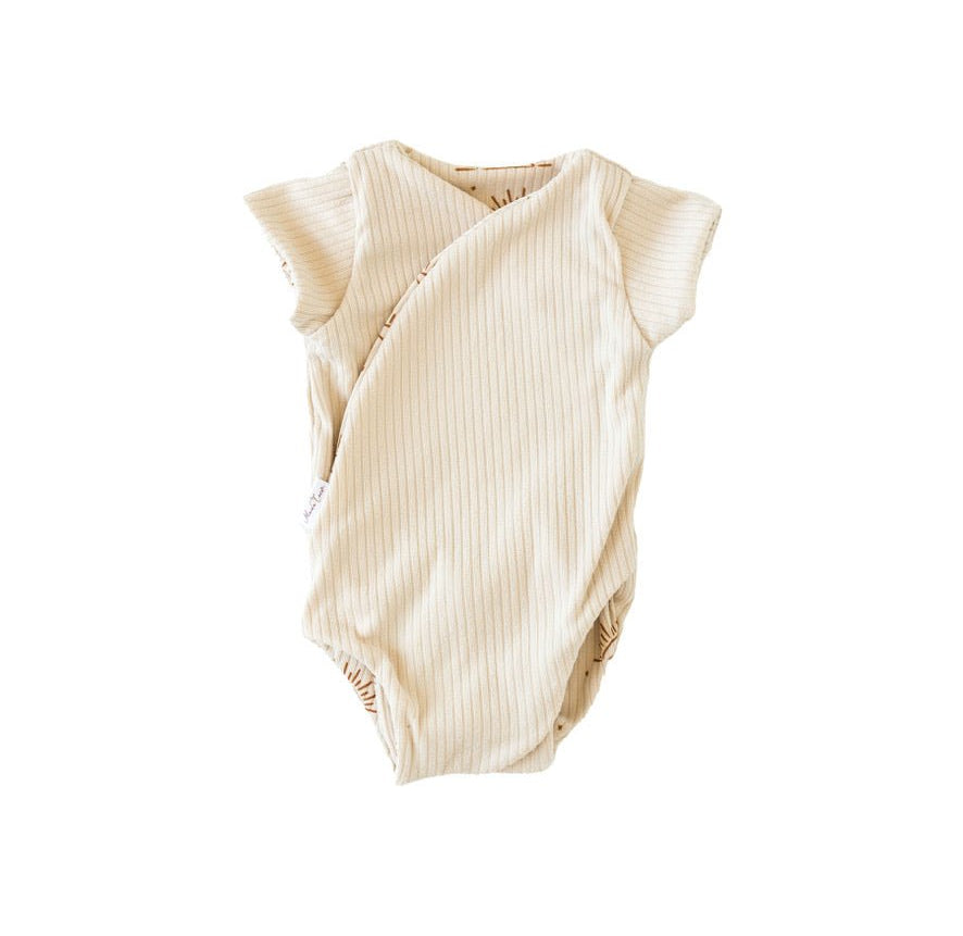 Everyday reversible short-sleeve winged bodysuit with Sandy Sunsets print and classic brushed softness.