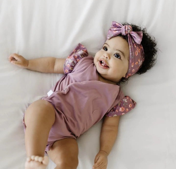 Peachy Lilac headwrap for babies, featuring a stylish bow detail.