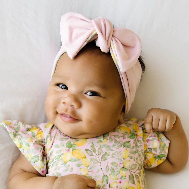 Headwrap with bow in Pink Lemonade design, made from classic brushed fabric.