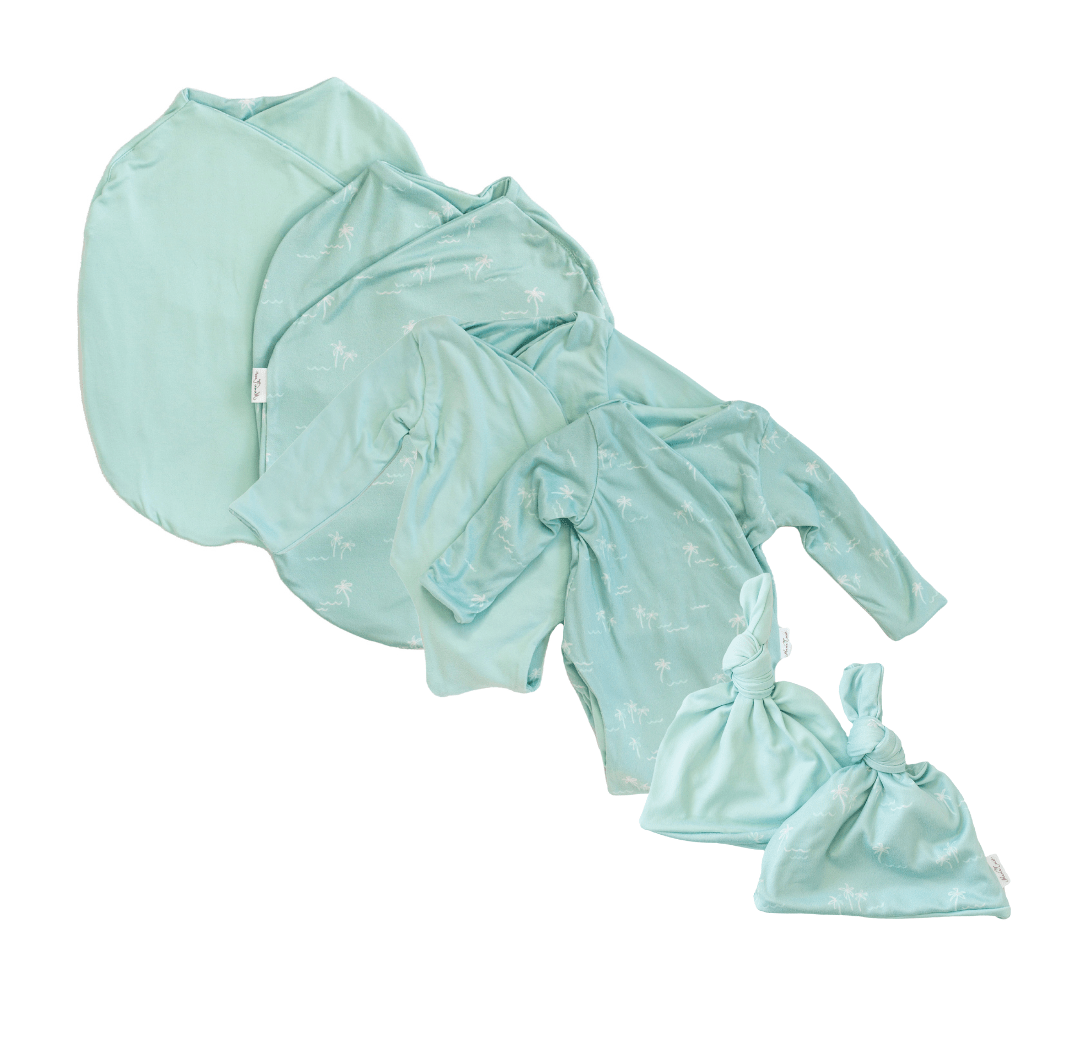 Newborn bundle with long sleeve essentials in classic brushed fabric with honeydew palms design.