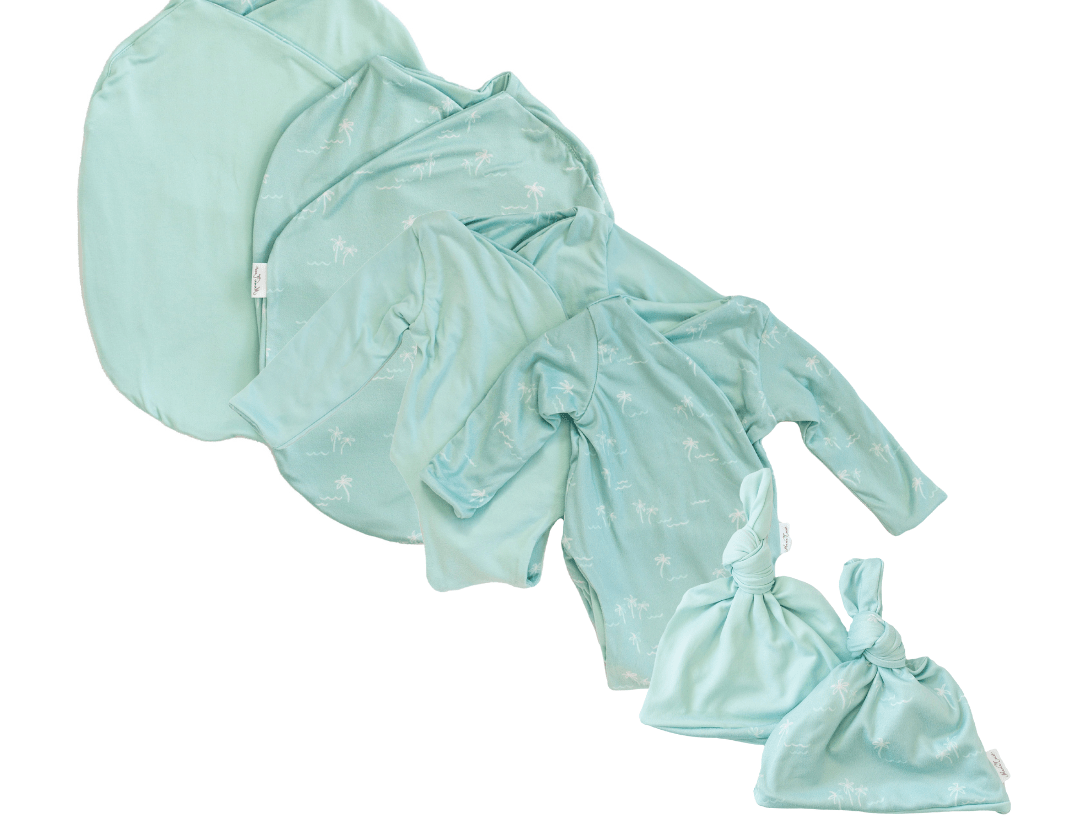 Newborn bundle with long sleeve essentials in classic brushed fabric with honeydew palms design.