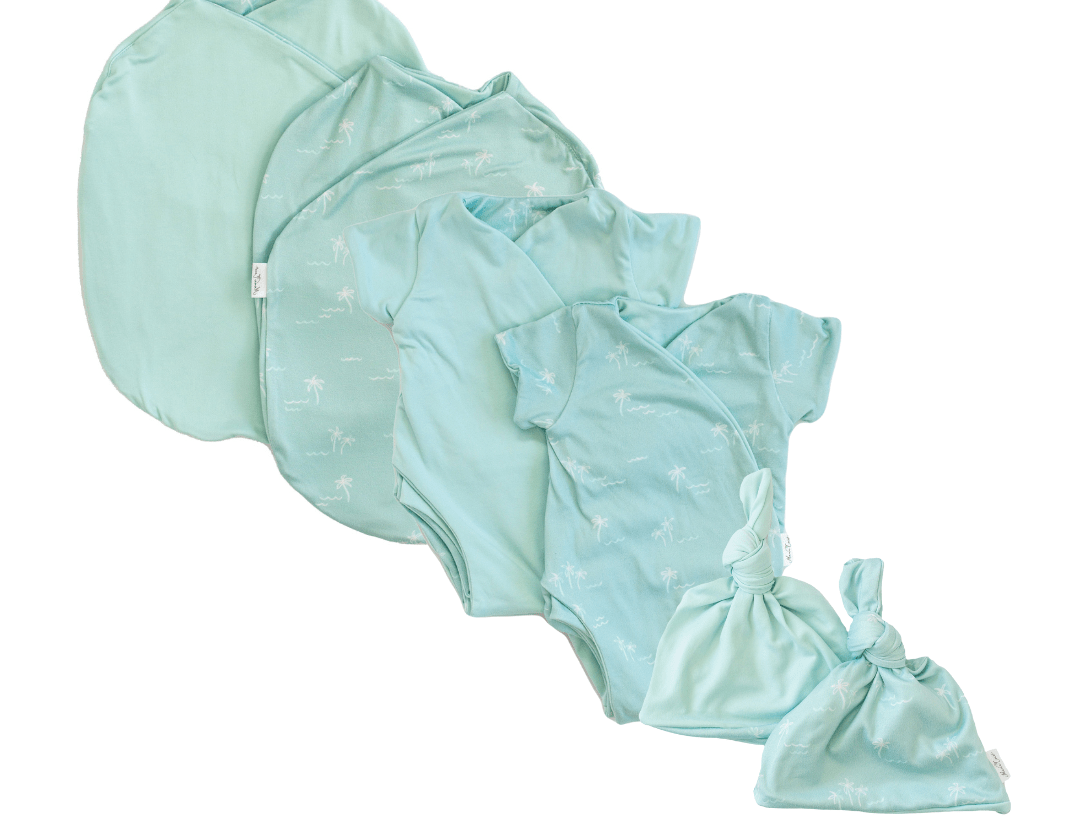 Newborn essentials bundle with short sleeves in classic brushed fabric with honeydew palms design.