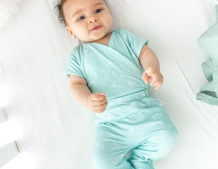 Honeydew palms design short-sleeve baby onesie and footie pants in classic brushed fabric.