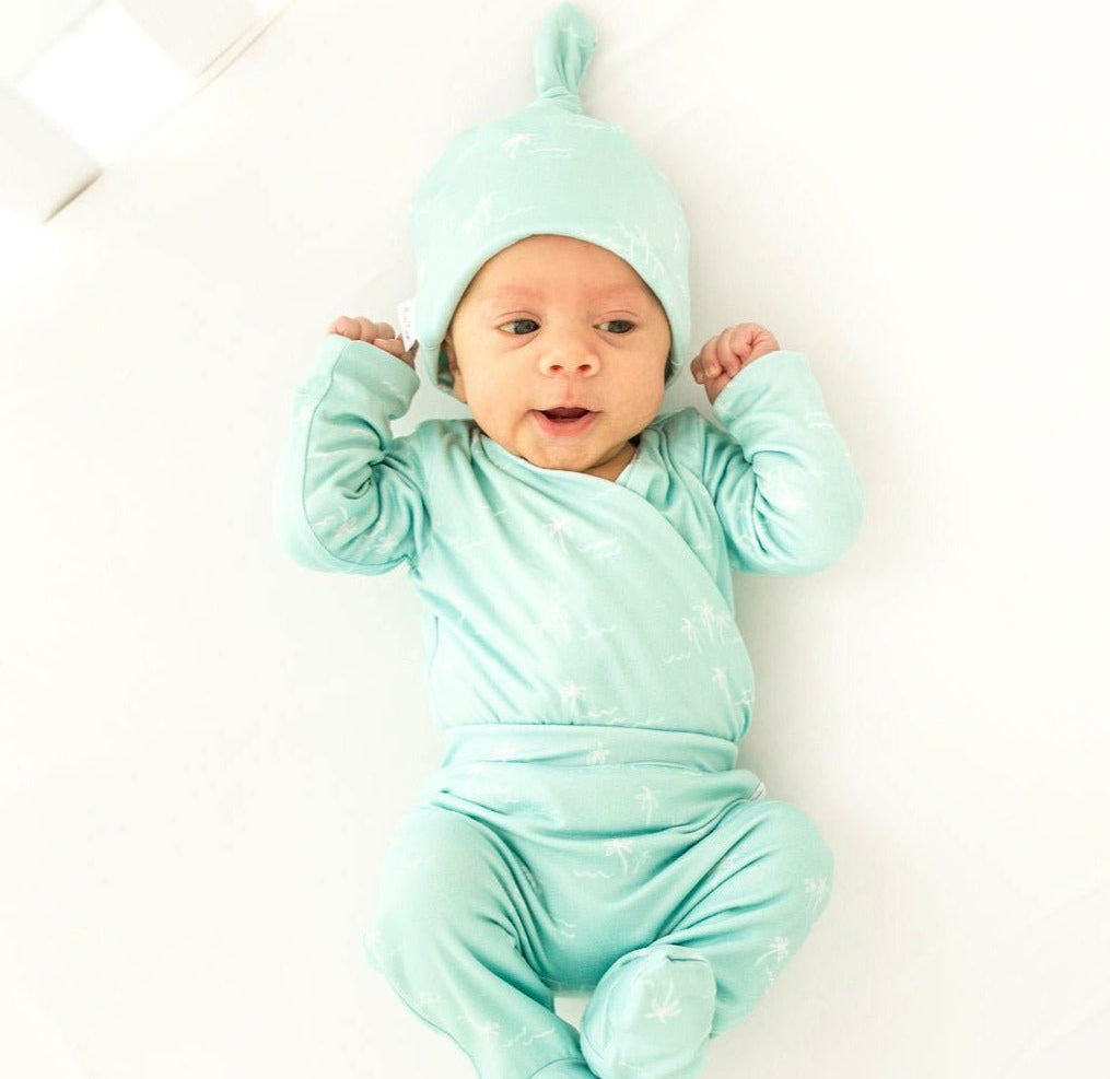 Honeydew Palms design baby winged bodysuit in classic brushed fabric.