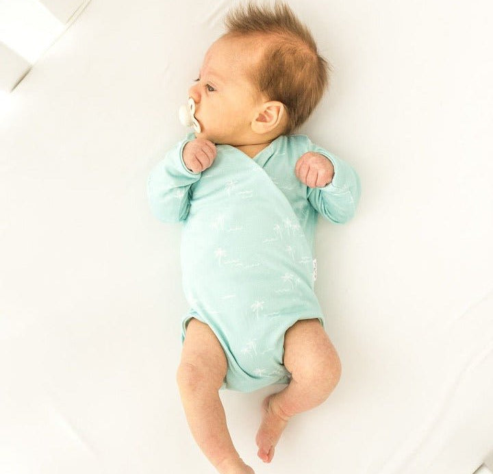Honeydew Palms design long-sleeved winged bodysuit.