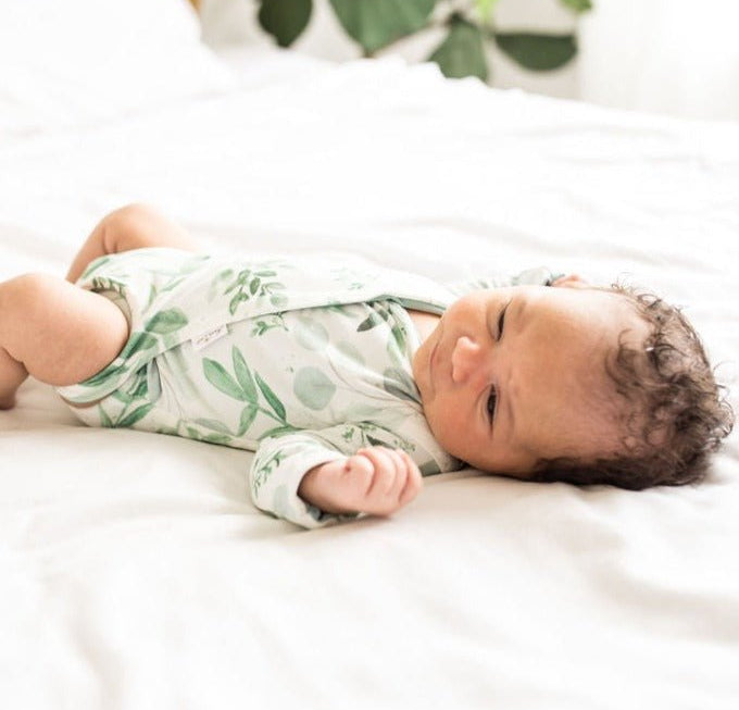 Saged Eucalyptus design long-sleeved winged bodysuit.