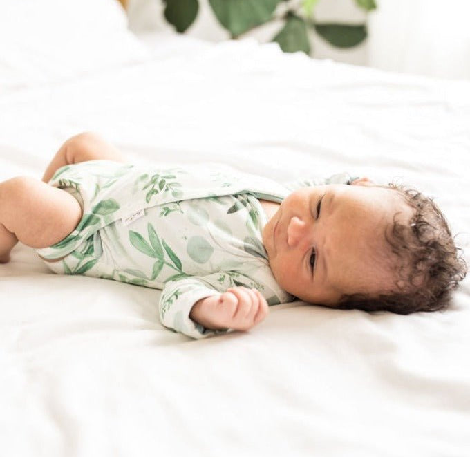 Saged Eucalyptus design long sleeve winged bodysuit.