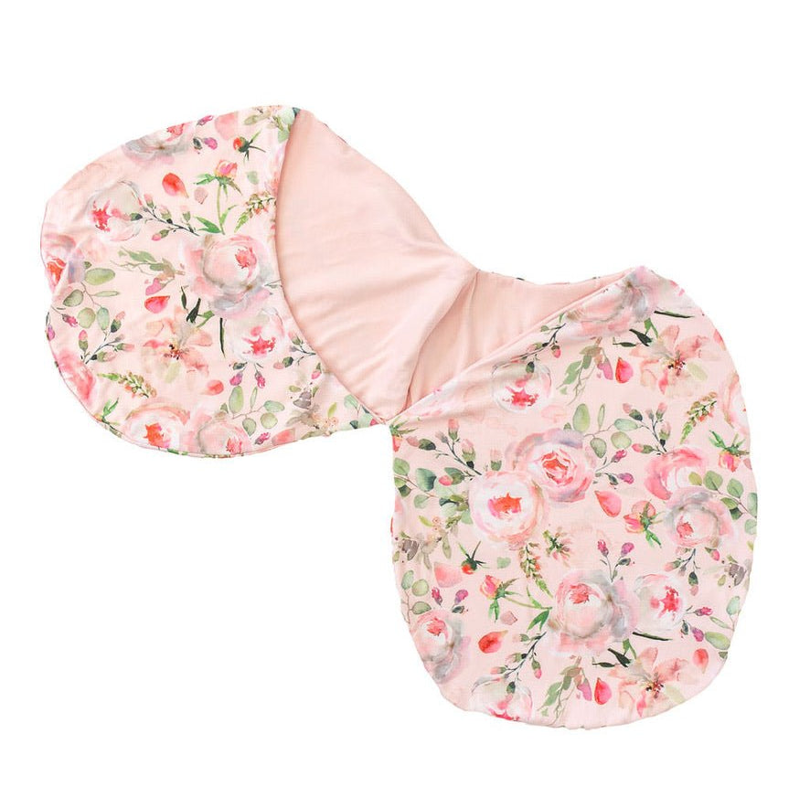 Newborn baby cocoon swaddle featuring Peachy Rose Fields design Silky Modal fabric.