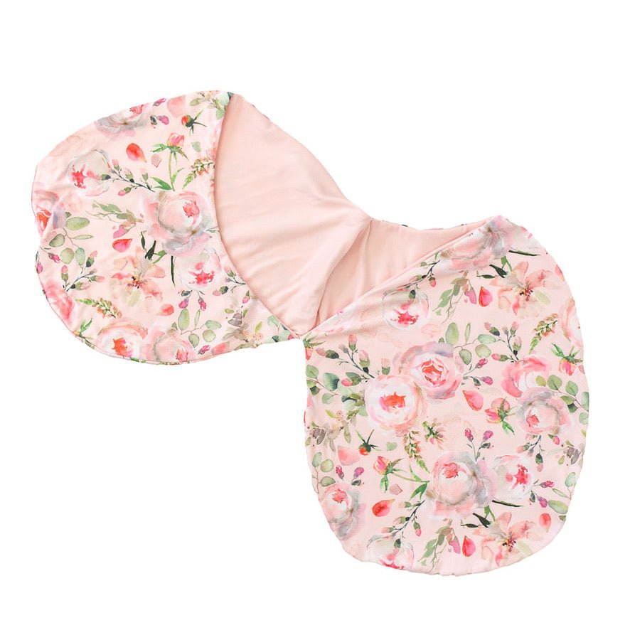 Newborn baby cocoon swaddle featuring Peachy Rose Fields design Silky Modal fabric.