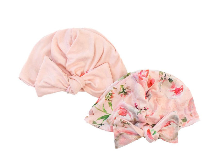 Reversible classic brushed baby beanie in peachy rose fields design.