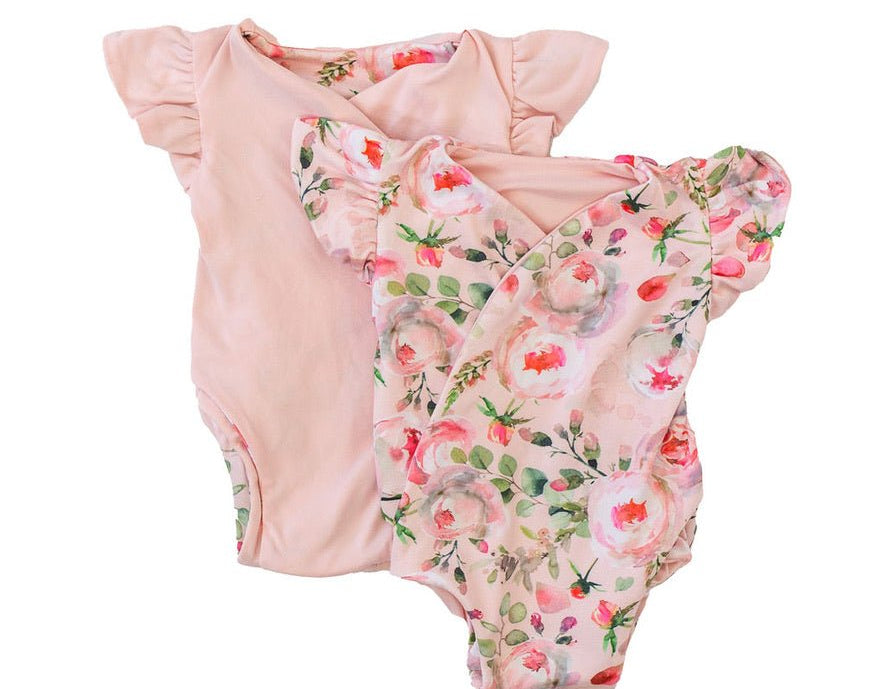 Reversible peachy rose fields design flutter sleeve baby onesie in classic brushed fabric.