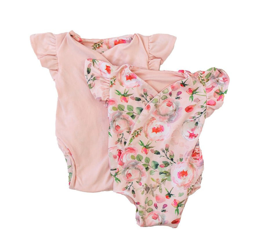 Reversible peachy rose fields design flutter sleeve baby onesie in classic brushed fabric.