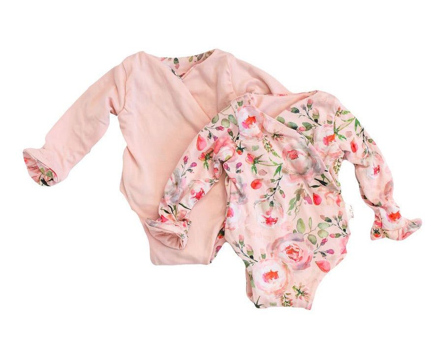 Reversible peachy rose fields long sleeve ruffle cuff baby onesie.