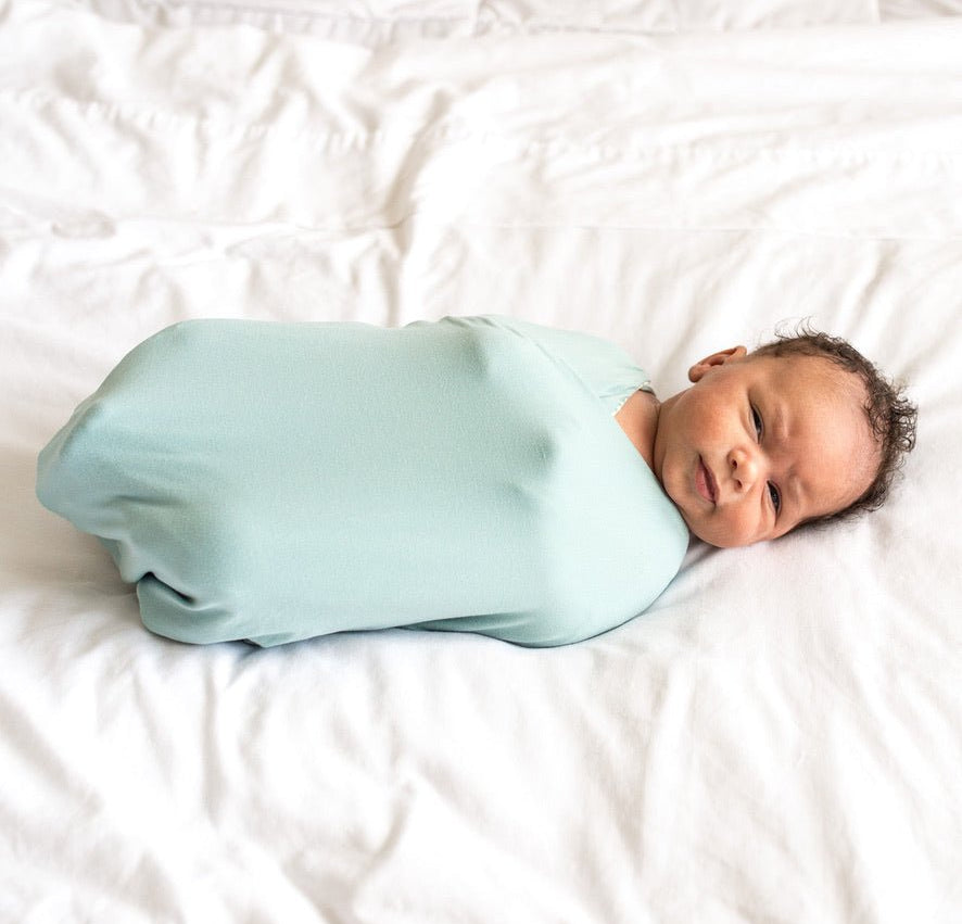 Reversible Silky Modal baby cocoon swaddle in Saged Eucalyptus for newborn comfort.