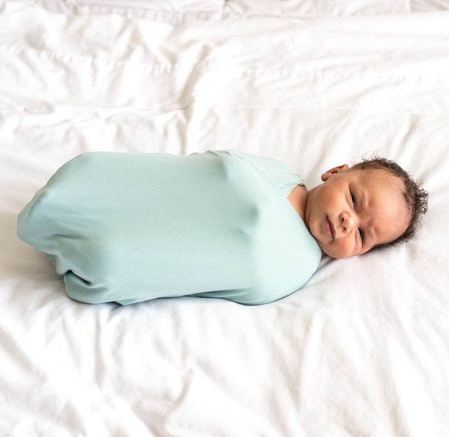 Reversible Silky Modal baby cocoon swaddle in Saged Eucalyptus for newborn comfort.