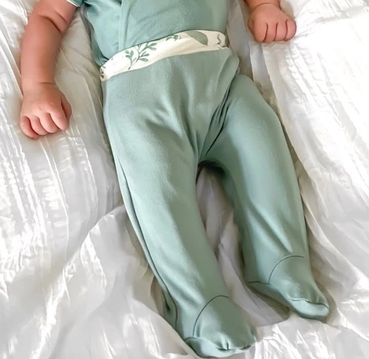 Reversible footie pants in saged eucalyptus design.