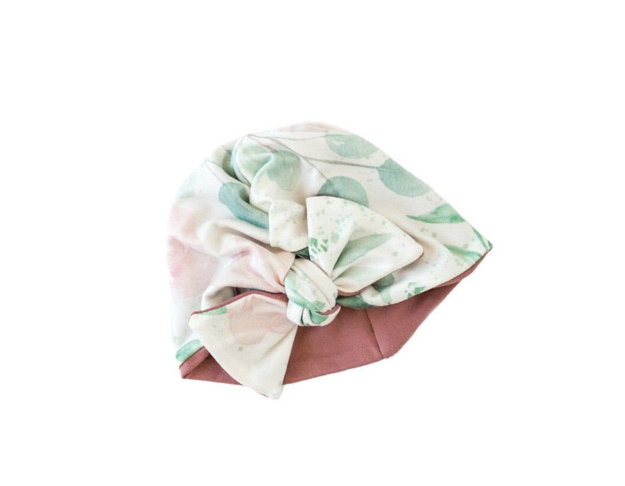 Reversible classic brushed baby beanie in blushing eucalyptus design.