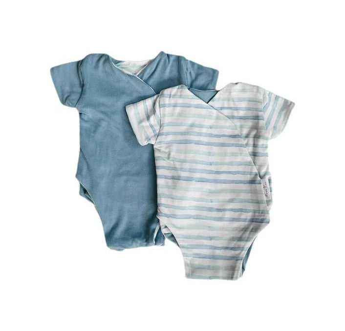 Reversible winged bodysuit in chambray waves design.