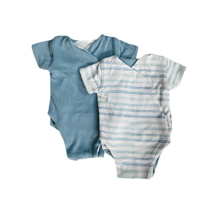 Reversible winged bodysuit in chambray waves design.