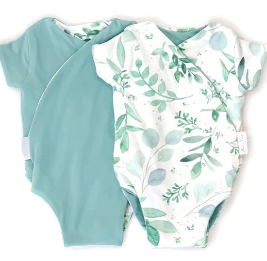 Reversible winged bodysuit in saged eucalyptus design.