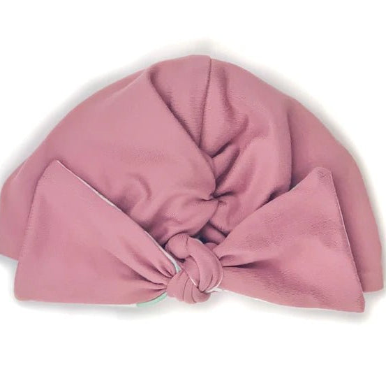 Comfortable reversible Blushing Eucalyptus ruched baby beanie with bow crafted from classic brushed baby fabric.