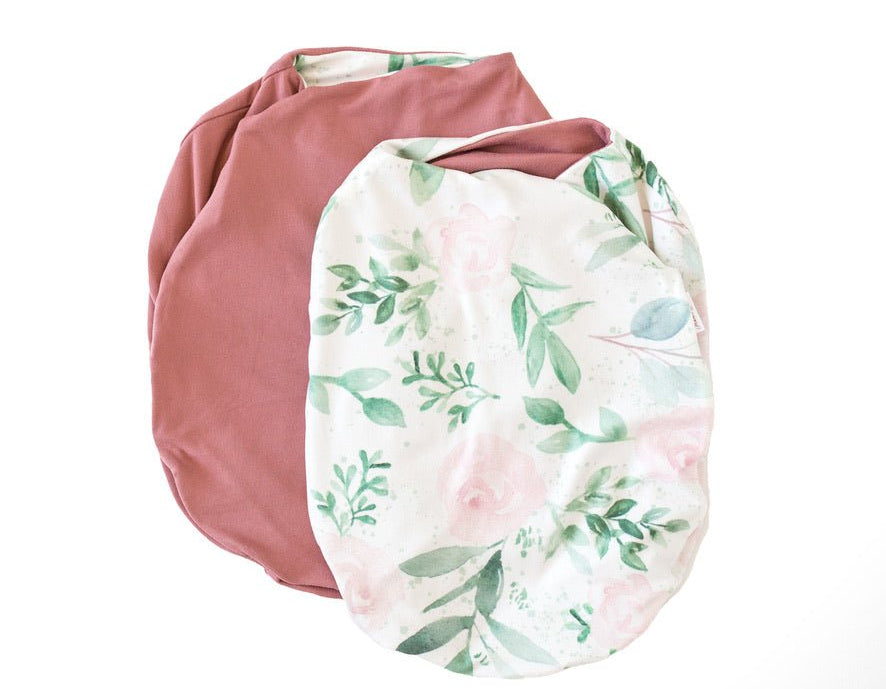 Reversible blushing eucalyptus design cocoon baby swaddle in classic brushed fabric.