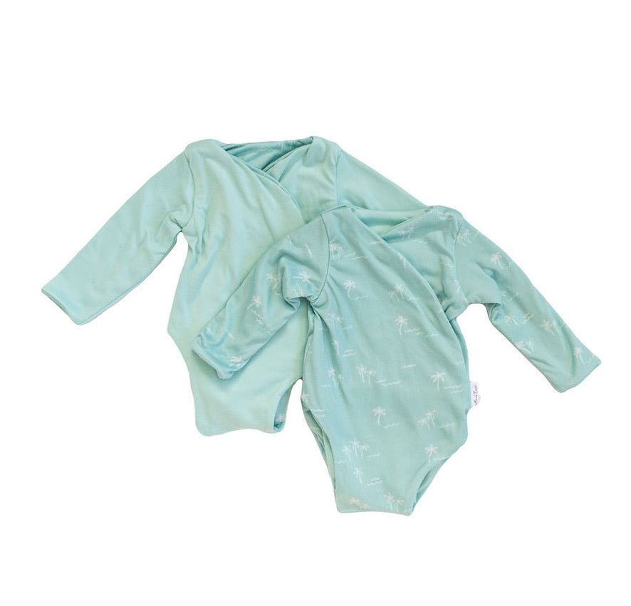 Reversible Honeydew Palms design long-sleeved winged bodysuit.
