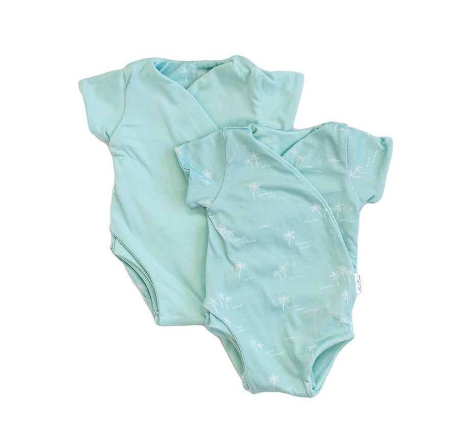 Soft classic brushed reversible short-sleeve winged bodysuit in the Honeydew Palms design for comfortable everyday wear.
