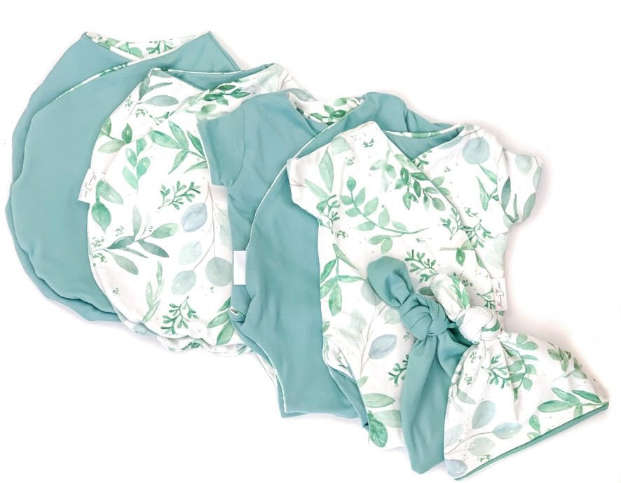 Newborn essentials bundle with short sleeves in classic brushed fabric with saged eucalyptus design.