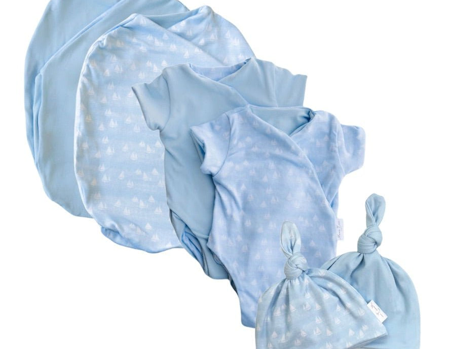 Newborn essentials bundle with short sleeves in classic brushed fabric with sailboat shores design.