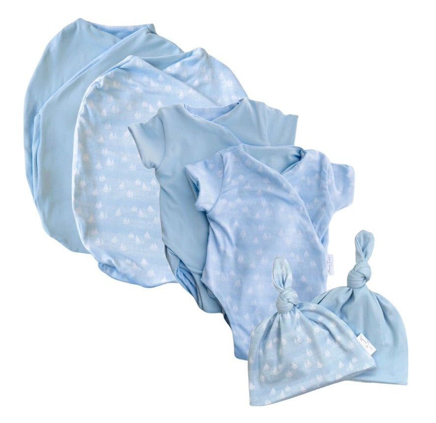 Newborn essentials bundle with short sleeves in classic brushed fabric with sailboat shores design.
