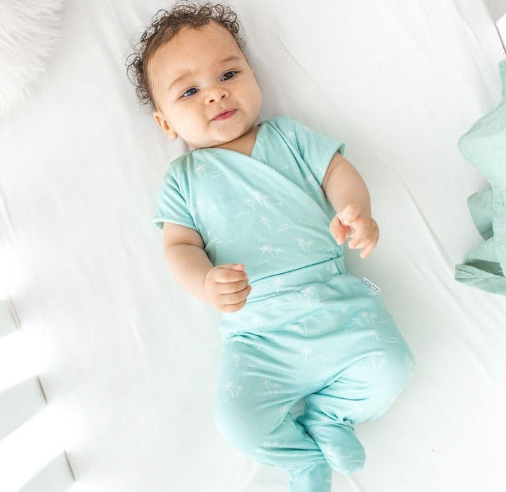 Soft classic brushed short-sleeve winged bodysuit in the Honeydew Palms design for comfortable everyday wear.