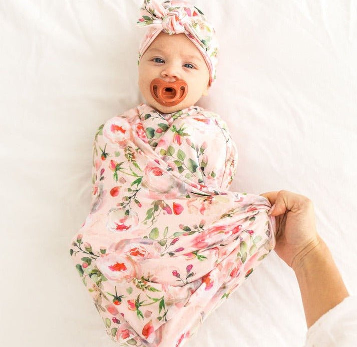 Silky Modal baby cocoon swaddle in Peachy Rose Fields for newborn comfort.