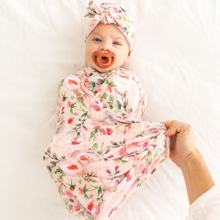 Silky Modal baby cocoon swaddle in Peachy Rose Fields for newborn comfort.