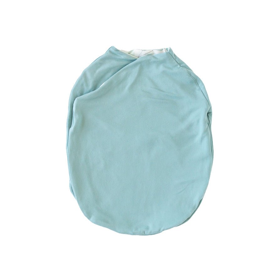 Reversible baby cocoon swaddle blanket made with smooth Silky Modal in Saged Eucalyptus design.