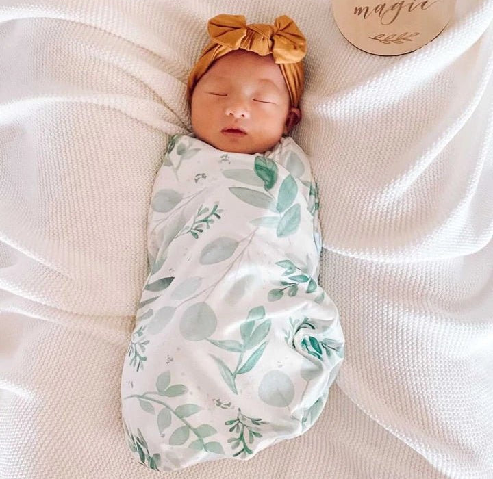 Newborn baby cocoon swaddle featuring Saged Eucalyptus Silky Modal fabric.