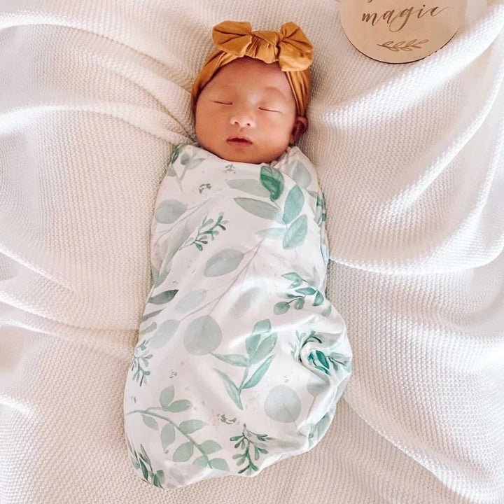 Newborn baby cocoon swaddle featuring Saged Eucalyptus Silky Modal fabric.
