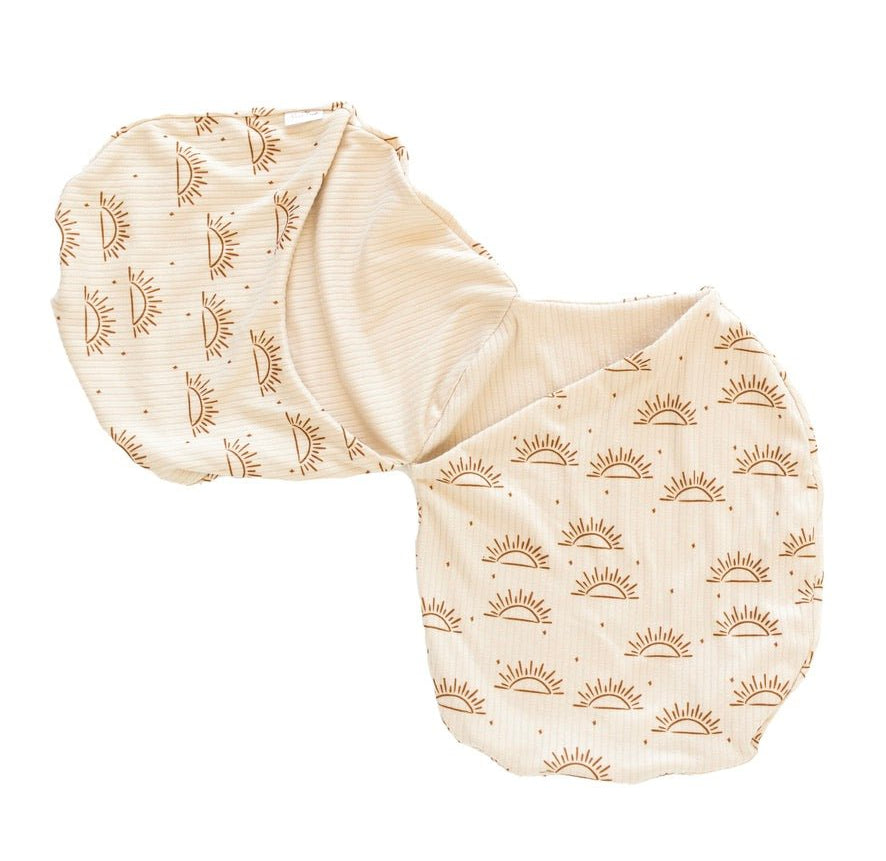 Silky Modal baby cocoon swaddle in Sandy Sunsets for newborn comfort.