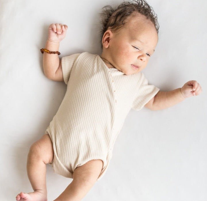 Reversible short-sleeve winged bodysuit featuring the Sandy Sunsets print in cozy classic brushed fabric.